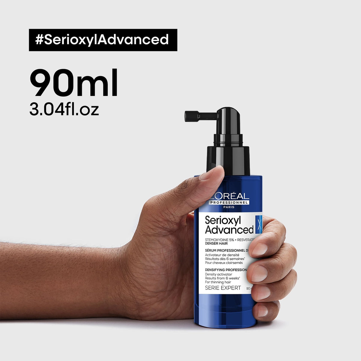 L’Oréal Professionnel SERIOXYL ADVANCED Density Activator Serum: 90-ml-Serum in der Hand