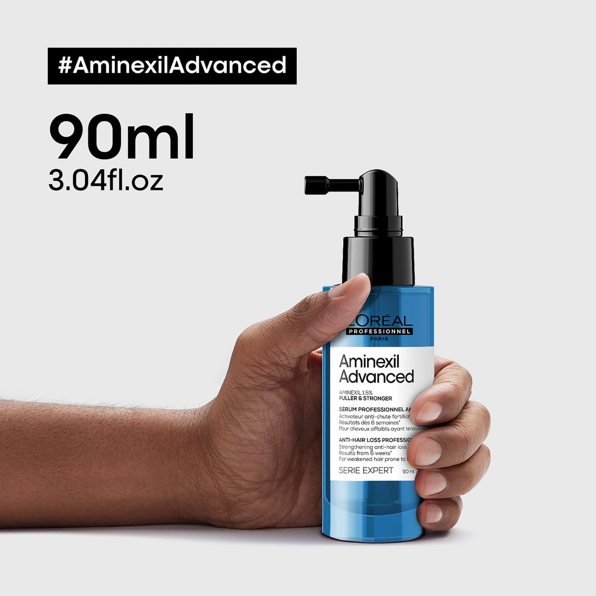 L’Oréal Professionnel AMINEXIL ADVANCED Kopfhautserum: 90-ml-Flasche in der Hand